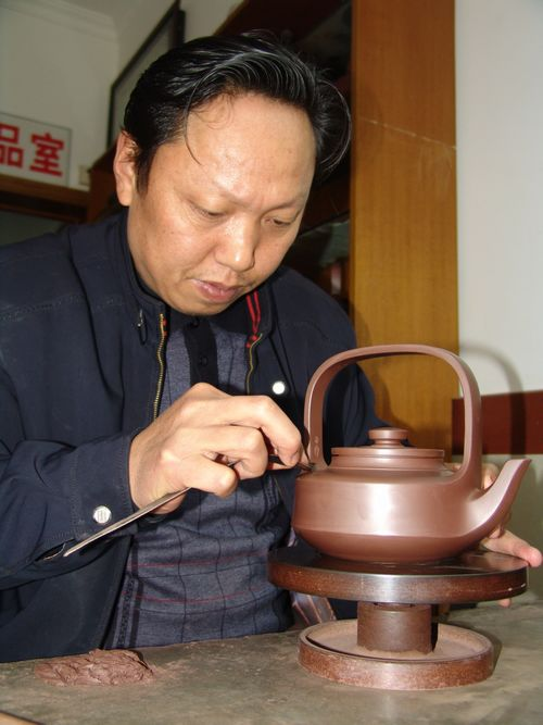 徐建军《寿桃壶》赏析 -中国紫砂艺术网